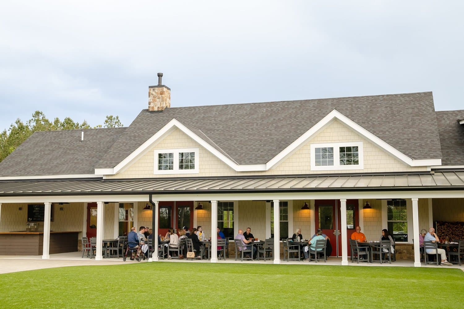 Guests gathering on the covered back porch